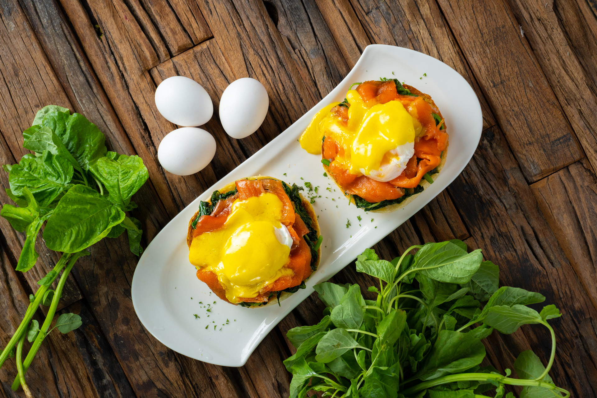 classic eggs benedict with smoked salmon and served on toasted muffin