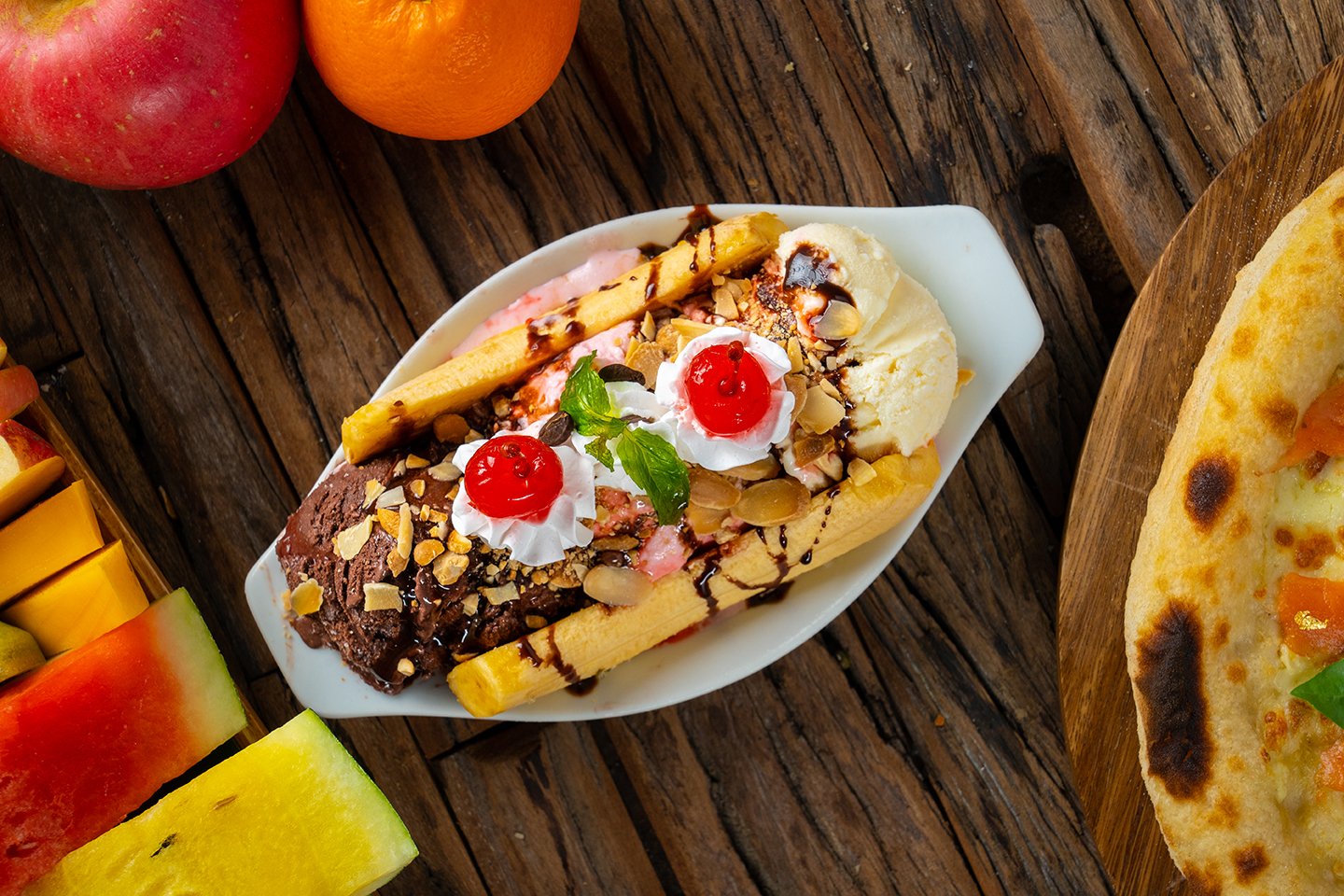 Banana with chocolate, vanilla and strawberry ice cream