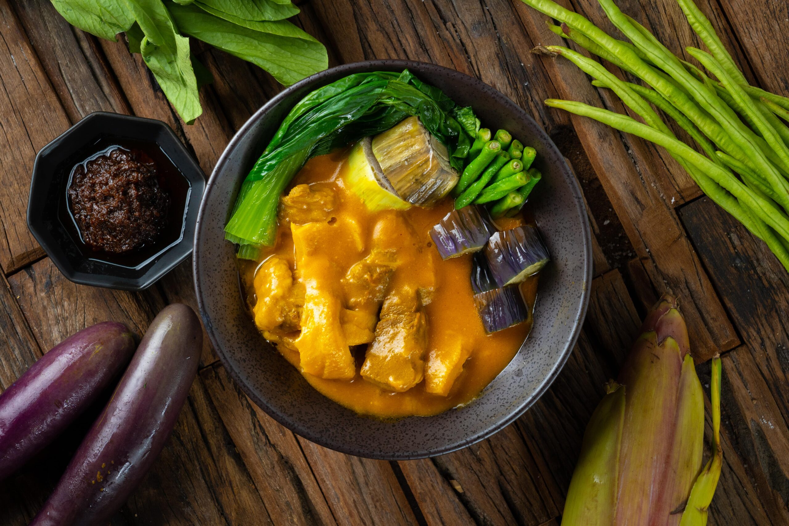a Filipino-favorite dish with beef sirloin, ox tripe and vegetables in peanut sauce